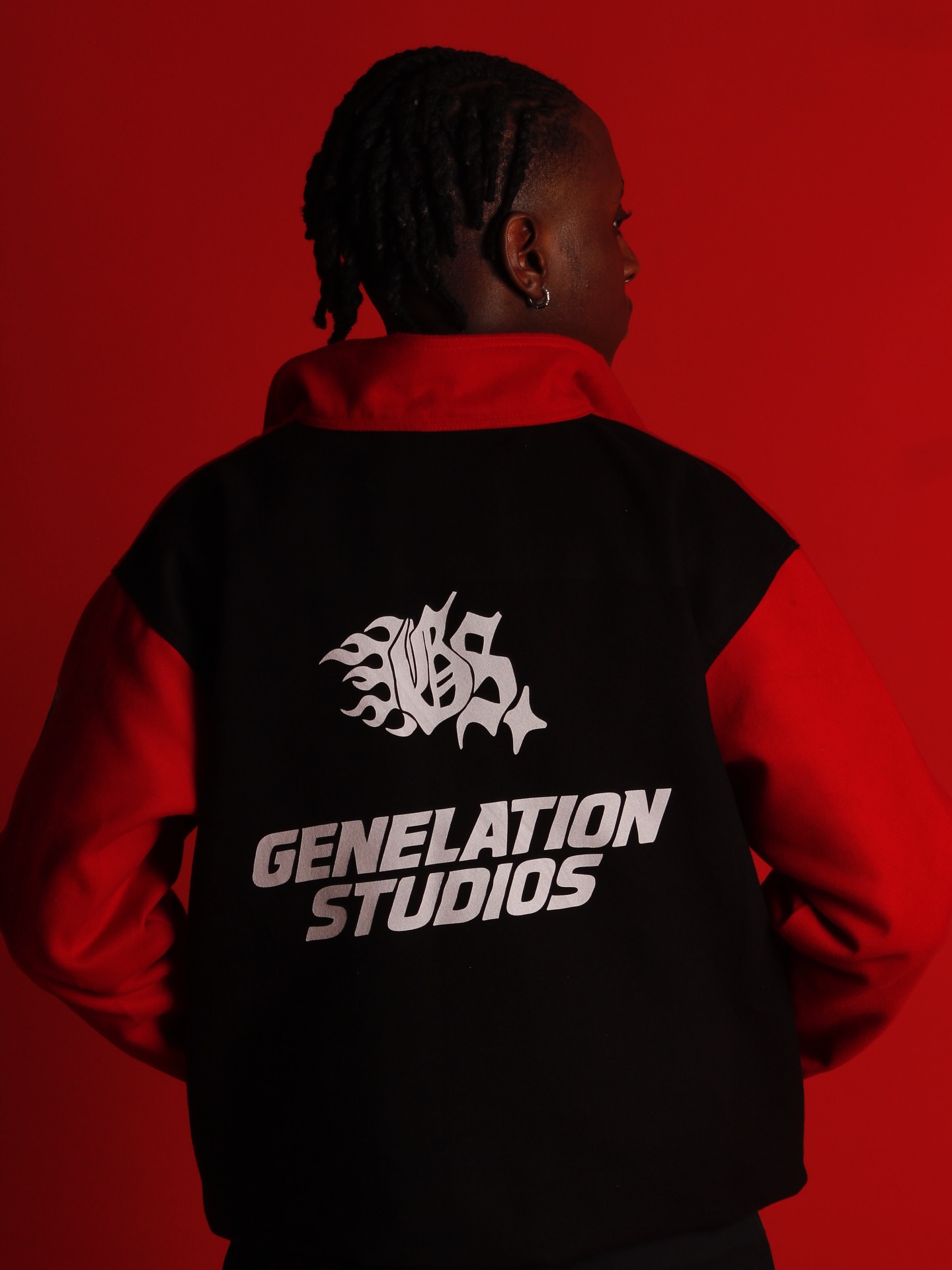 Genelation Studios creative in a red studio